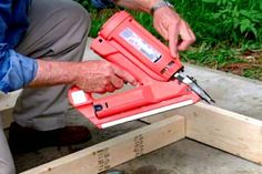 a man working with tools on some wood