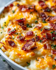 a casserole dish with cheese and bacon