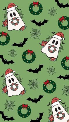 a green background with christmas decorations and ghost faces on it's face, surrounded by bats