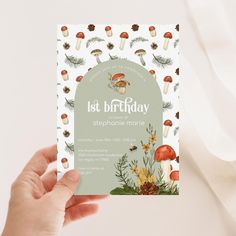 someone holding up a birthday card with mushrooms on it