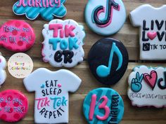 decorated cookies are arranged on a table with the words'tik tok tok '