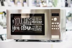 a stainless steel microwave with the words you use it to make your own motivational message