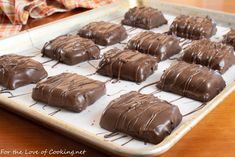 chocolate covered desserts on a baking sheet ready to be baked in the oven for consumption