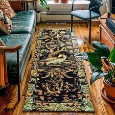 a living room filled with furniture and a rug on top of a hard wood floor