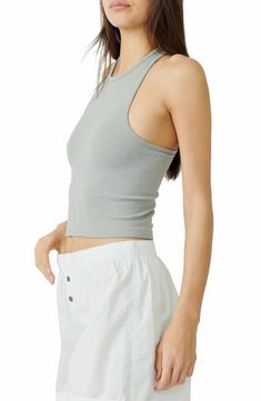 Lounge or layer in this oh-so-versatile ribbed crop top that looks (and feels) great wherever you go. 17" length (size Medium/Large) Crewneck Sleeveless Racerback 92% nylon, 8% spandex Machine wash, dry flat Imported Basic Cropped Ribbed Tank Top, Casual Slightly Cropped Tank Top For Spring, Everyday Seamless Spring Crop Top, Sporty Cropped Hem Crop Top For Summer, Versatile Everyday Spring Crop Top, Casual Slightly Cropped Tank Top For Summer, Casual Seamless Tank Crop Top, Casual Slightly Cropped Summer Tank Top, Ribbed Racerback Crop Top For Summer