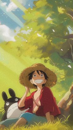 a woman sitting in the grass with a hat on her head and an animal behind her