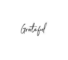 the word grateful written in cursive writing on a white background with black ink