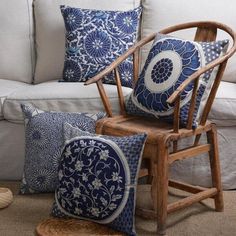 a living room filled with furniture and pillows