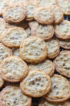 a bunch of cookies sitting on top of a cooling rack