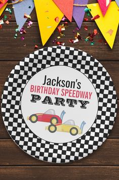 a personalized birthday party plate with a race car design on the front, and confetti streamers in the background