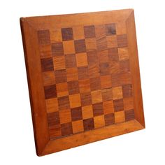 a wooden chess board is shown on a white background