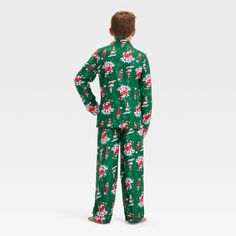 They'll love gearing up for bedtime during the holiday season with the Elf on the Shelf Coat Pajama Set. This pajama set includes a long-sleeve button-down pajama shirt and pull-on pajama shorts, both crafted from 100% polyester fabric for all-night comfort. Designed in a green hue with snowflake icons, both pieces feature Tinsel and Timber graphics for cute, festive style. Christmas Coat, Family Pajama Sets, Cozy Pajamas, Matching Family Pajamas, Kids Clothes Boys, Pajama Pant, Family Pajamas, Long Sleeves Coats, Teenage Boys