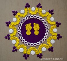 an intricately designed design with yellow, purple and white flowers on a wooden surface