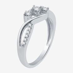 From the Love Lives Forever collection comes this eye-catching 3-stone promise ring featuring a trio of round-cut genuine diamonds at the center set in 10K White Gold. The ring's band adds interest with a braided design and additional genuine diamonds for extra sparkle. Ring Style: Engagement Rings, 3-Stone RingsDiamond Clarity: I2-I3Setting: ProngShape: RoundStone Cut: RoundDiamond Color: I-JMetal Color: WhiteCenter Stone Weight: Less Than 1/10 Ct.Rounded Carat Weight: 1/3 Ct. T.w.Care: Wipe Cl Three Stone Cubic Zirconia Diamond Ring, Anniversary Three Stone Cluster Ring, Three Stone Cluster Ring For Anniversary, Three Stone Diamond Ring Fine Jewelry, Three Stone Diamond Promise Ring With Round Band, Three Stone Diamond Promise Ring, Three Stone Promise Ring With Round Band, Three Stone Cluster Promise Ring, Three Stone Diamond Ring With Round Band