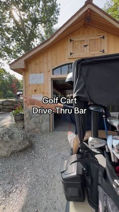 a golf cart parked in front of a wooden building