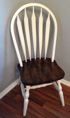 a white chair sitting on top of a hard wood floor