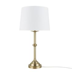 a gold lamp with a white shade on the base and a cord attached to it