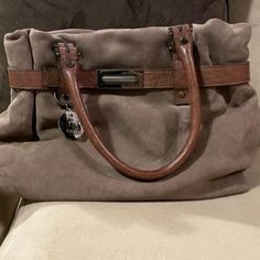 Listed Price Is As Low As I Can Go. No Lower Offers, Please. Taupe Nubuck Leather Silvertone Hardware Brown Leather Handles (Will Fit Over Shoulder, Snugly) Interior Center Zippered Section Interior Zippered Pocket Black Lanvin Signature Fabric Lining Taupe Shoulder Bag With Palladium Hardware For Everyday, Designer Taupe Bag With Detachable Handle, Taupe Travel Bag With Palladium Hardware, Formal Taupe Bag With Silver-tone Hardware, Designer Gray Bags, Designer Gray Bag With Detachable Handle, Designer Gray Bags With Detachable Handle, Designer Taupe Bags For Daily Use, Formal Gray Bags With Gunmetal Hardware