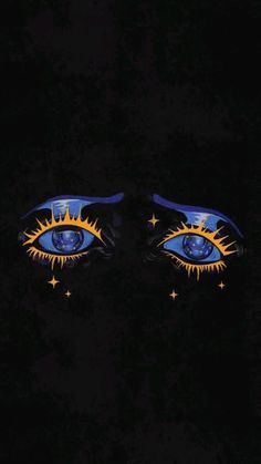 two blue eyes with yellow stars painted on them in the dark, one is looking into the distance