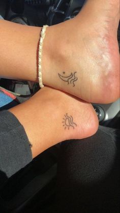 two people with matching tattoos on their feet