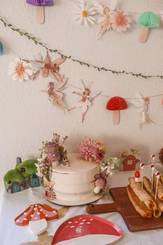 a table topped with a cake and lots of decorations