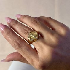 This 18k gold-filled ring combines faith, fashion, and symbolism in one stunning piece. With the powerful Saint Benedict symbol etched into the signet design, wearers can proudly display their devotion while making a bold fashion statement. Perfect for those who value both style and spirituality. * Metal: 18k Gold filled *Hypoallergenic * Water-resistant * Handcrafted in Brazil French Collection, Saint Benedict, Bar Gifts, Forever Jewelry, Book Candle, Gold Filled Ring, Home Candles, 50th Gifts, Bridal Shop