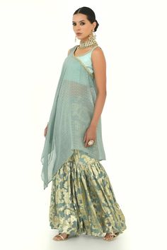 Misty blue asymmetric hemline cape with polka patterns. Comes with floral woven brocade gathered sharara and blouse. - Aza Fashions Cotton Silk Pre-draped Saree With Gota Work, Anarkali Brocade Palazzo Set With Traditional Drape, Bollywood Brocade Sharara With Unstitched Blouse, Sheer Dupatta Cotton Silk Choli, Brocade Traditional Wear With Gota Work, Traditional Wear With Gota Work In Brocade, Designer Brocade Sharara Floor-length, Designer Cotton Silk Sharara Floor-length, Designer Wear Floor-length Cotton Silk Sharara