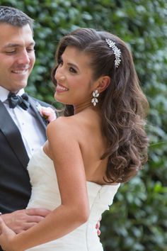 a bride and groom standing next to each other