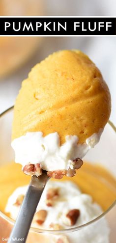 a spoon full of pumpkin fluff with whipped cream on top