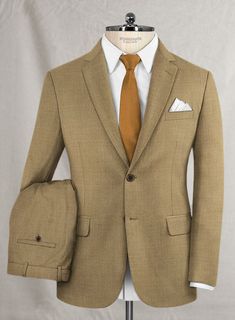 A decent suit will make you feel a million dollars. There are so many beautifully designed suits out there, but our Reda Worsted Khaki Wool suit makes a man look much dressier and dapper, adding charisma for a formal and carefree look. Crafted from 100% wool, our Super 110's wool suit gets you ready for the next office meeting while grabbing drinks with friends. 
 
Look Includes   Reda Worsted Khaki Wool Fabric  Two Button Jacket Style  Notch Lapel  Real Horn Brown Buttons  Single Vent  Three Cu Dapper Fitted Suit For Business Casual, Dapper Fitted Business Casual Suits, Bespoke Brown Suits For Semi-formal Occasions, Semi-formal Custom Fit Single Breasted Sets, Semi-formal Single Breasted Custom Fit Set, Brown Fitted Sport Coat For Formal Occasions, Dapper Double Breasted Suit With Notch Lapel, Semi-formal Custom Fit Single Breasted Suits, Custom Fit Notch Lapel Sets For Business Casual