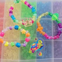 I have been collecting and making kandi since my early rave days in 2000. I will be making special kandi sets that include vintage beads from my collection. Have a little piece of kandi history. I created a playlist on my YouTube channel Kandi Toybox (My kandi bead collection) if you would like to see my collection! These kandi bracelets are made with mostly vintage beads from the 90s,early 2000s and some new beads. New beads are some of the pony beads. Includes 3 bracelets. Bracelet size 7-8 inches  This set is premade and is ready to ship! Perfect for any event! You will get lots of compliments in this unique wearable art! Stand out at your next event! Birthday party  Edm festival  Raves Rave outfit  Festival outfit Pride Stocking stuffer  Party favor  Glow party Rave birthday  Rave anni Playful Plastic Beaded Bracelets, Rainbow Beaded Bracelets For Rave, Rave Style Plastic Beaded Bracelets, Playful Plastic Bracelets For Party Favors, Multicolor Rave Stretch Bracelet Gift, Multicolor Rave Style Stretch Bracelet For Gift, Playful Multicolor Stretch Bracelet For Party Favors, Multicolor Rave Style Stretch Bracelet Gift, Playful Handmade Plastic Stretch Bracelet