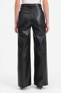 Faux leather adds plenty of attitude to these high-waisted pants styled in a roomy wide leg. 32 1/2" inseam; 22" leg opening; 12" front rise Zip fly with button closure Five-pocket style 100% polyester with polyurethane coating Machine wash, dry flat Imported Faux Leather Wide Leg Pants, Leather Wide Leg Pants, Fall Wardrobe Essentials, Black Leather Pants, Denim Blouse, Cute Blouses, Jumpsuit Shorts Rompers, Tshirt Skirt, Made Clothing