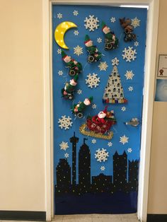 a door decorated with snowflakes and christmas decorations, including santa clause on his sleigh