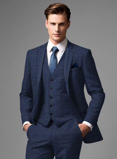 Stay on-trend and elevate your style with our exceptionally chic Loro Piana Rocco Wool Silk Linen Suit. Masterfully tailored from a premium blend of wool, silk, and linen, this suit features an eye-catching plaid pattern in vibrant blue and black tones, exuding a sense of refined sophistication. Its tactile experience is simply irresistible, cocooning you in unparalleled comfort. Whether you're gearing up for a grand adventure, relaxing with friends, or heading to a party, this suit will be your versatile and stylish companion.  A marriage of elegance and comfort, Loro Piana fabrics are made using the highest quality raw materials in the world, in their purest form or blended together. A sophisticated response to the dictates of contemporary elegance, these fabrics lend themselves to a wid Elegant Plaid Blazer For Business, Elegant Plaid Blazer With Notch Lapel, Elegant Plaid Tweed Jacket For Business Casual, Elegant Plaid Suit For Semi-formal Occasions, Elegant Plaid Semi-formal Blazer, Elegant Plaid Blazer For Semi-formal Occasions, Elegant Semi-formal Plaid Blazer, Elegant Plaid Suit With Notch Lapel, Elegant Plaid Tweed Jacket With Suit Collar