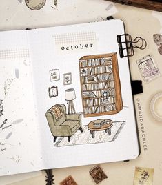 an open notebook with a drawing of a living room