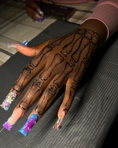 a woman's hand with painted nails and manicures on her left hand