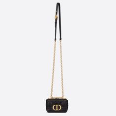 The Dior Caro bag is a creation that combines modernity and timeless elegance. Crafted in supple calfskin with Cannage stitching, it features a flap adorned with a CD clasp, inspired by the seal of a Christian Dior perfume bottle. The miniature shape's chain shoulder strap has a leather insert that provides a comfortable and adjustable carry, to be with day or evening attire. Front CD clasp 1 interior compartment 1 rear patch pocket Removable and adjustable chain shoulder strap with leather insert Made in ItalyCOMPOSITIONCannage CalfskinProduct code:S2022UWHC_M900SIZE GUIDE WIDTH×HEIGHT×DEPTH：13 x 8 x 4 cm(Length from the top of the strap to the top of the bag: minimum approx. 50 cm, maximum approx. 53 cm)Sized to hold AirPods Pro, lipstick, and keys Small Dior Caro Bag, Medium Dior Key Bag, Dior Caro Bag, Dior Caro Zipped Pouch With Chain, Dior Perfume Bottle, Lady Dior Chain Pouch, Dior Caro, Christian Dior Crossbody Bag Black, Christian Dior Perfume