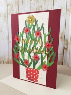 a christmas card with a cactus in a pot