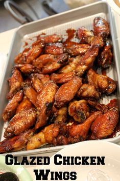 glazed chicken wings in a pan on a table