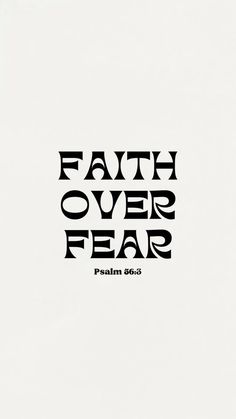 a black and white photo with the words faith over fear