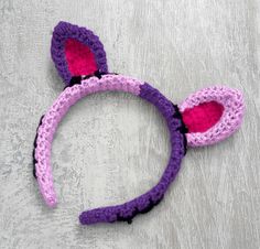 Half lilac and half violet cat ear headband with each ear being the opposite colour to the side it is on. The inner ears are hot pink and there are black embroidered stitch marks to look like the cat has been pieced together. NecroKitty Crochet Headband by VelvetVolcano Lilac Cat, Cosy Crochet, Inner Ear, Frankenstein's Monster, Good Hair, Cat Ear, Good Hair Day, Creepy Cute, Hair Day