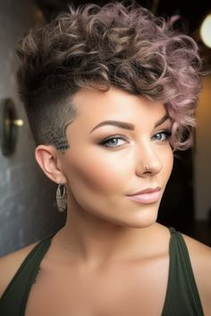 The Shaved Hair style trend's popularity is driven by its edgy and bold look, seen as attractive and a symbol of self-confidence. Half Shaved Hair Short Curly, Curly Half Shaved Hair, Short Curly Side Shave, Assymetrical Haircut Curly Hair, Shaved Sides Curly Top, Short Curly Faux Hawk, Very Short Permed Hair, P Nk Hairstyles, Short Curly Undercut Women