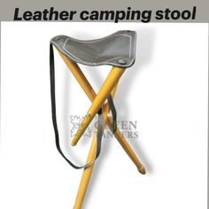 the leather camping stool is made from wood and has two legs, one with a padded seat