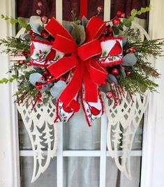 a christmas wreath hanging on the front door