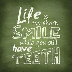 a chalkboard saying life is too short smile while you still have teeth on it