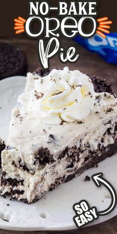 a white plate topped with a slice of cake covered in ice cream and oreo