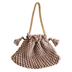 LYON macrame bag is handcrafted by local artisans in Denpasar, Bali from natural cotton yarns. Each piece is made with impeccable craftsmanship that takes up to a week to complete. Reflecting the peaceful and free-spirited life in Bali, Lyon bag is the one true bag for every trip. DETAILS- Color: toasted beige- Dimension: 13 (L) x 8 (H) x 0.5 (D) inches- Drawstring fastening at top- Gold chain strap drop: 10 inches, 0.5 inches strap width- Composition: 100% natural cotton yarn- Made by local art Cream Macrame Crochet Bag For Everyday Use, Natural Straw Bag With Macrame For Everyday Use, Eco-friendly Macrame Crochet Bag For Everyday Use, Beige Macrame Straw Tote Bag, Beige Macrame Tote Straw Bag, Eco-friendly Beige Braided Crochet Bag, Beige Crochet Bag With Macrame For Everyday Use, Natural Color Crochet Macrame Bag For Everyday, Everyday Natural Macrame Crochet Bag