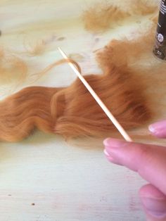 someone is working on something that looks like hair