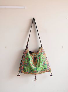 Welcome to HarmonyHandicraftCo Vintage banjara hand embroidery shoulder bag is large enough to hold everything you need throughout your day, Made of antique hand-embroidery. Thread textiles, with intricate embellishments, bag is truly unique. Size in Inches ( Approx ) Height with handle  31 Inches Bag Height - 14 Inches Width - 19 Inside Pocket - 1 Outside Pocket - No Very colorful and striking color purse, It can be a unique gift for girls, girl friends, sisters, daughters. Housewives, and can Floral Embroidered Hobo Shoulder Bag, Embroidered Tote Bucket Bag For Everyday Use, Rectangular Embroidered Beach Bag For Everyday Use, Embroidered Shoulder Beach Bag For Daily Use, Embroidered Satchel Hobo Bag For Daily Use, Embroidered Bucket Shoulder Bag For Travel, Embroidered Shoulder Bucket Bag For Travel, Embroidered Hobo Bag Tote For Travel, Everyday Embroidered Hobo Shoulder Bag