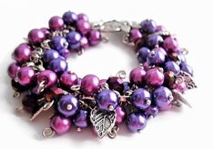 This pretty and bright perfect for any season magenta and purple cha-cha pearl charm bracelet is a head-turner. Fun-to-wear big and bold statement accessory for any dress occasion. A unique gift idea for a bohemian-style lover would make a nice addition to your jewelry collection.  A chunky cuff bracelet created with 8 mm glass pearl and sparkly crystal beads in different shades of purple individually treaded on the silver-plated pins and attached to a silver-tone chain. It has multiple Tibetan Chunky Cuff Bracelet, Chunky Silver Bracelet, Silver Pearl Bracelet, Large Dangle Earrings, Pearl Charm Bracelet, Small Drop Earrings, Dangle Bracelet, Rose Quartz Earrings, Leaf Bracelet